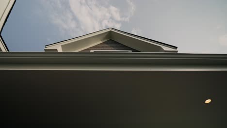 revealing shot of luxury home's upward-facing outdoor window