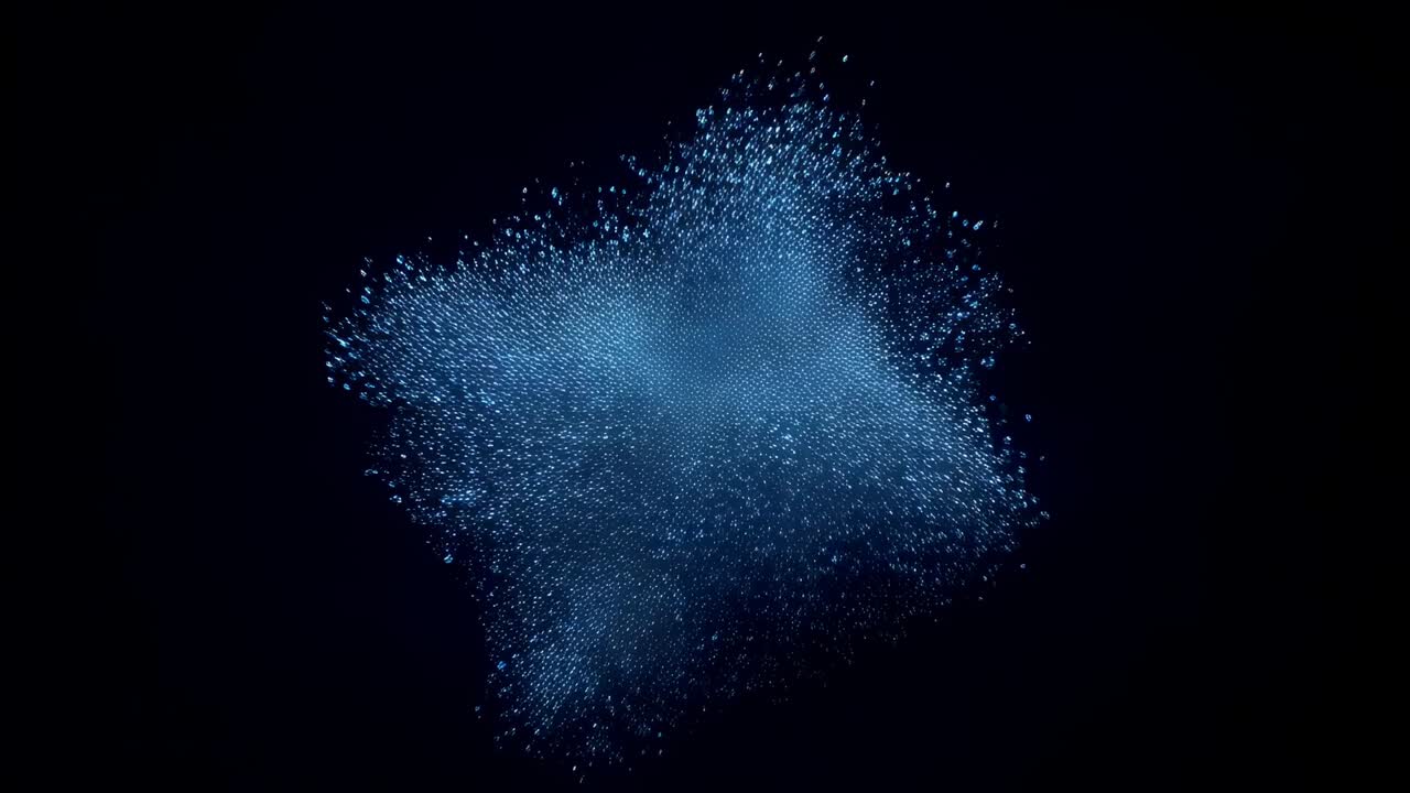Expanding blue particle cloud loosening and shedding flakes as camera shifting closer in void