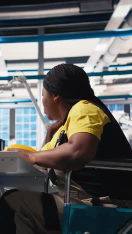 vertical video photovoltaics factory worker with physical impairment using pc