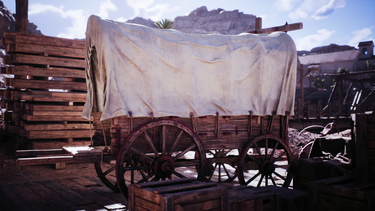 Historic wooden wagon covered with canvas in an outdoor rustic setting