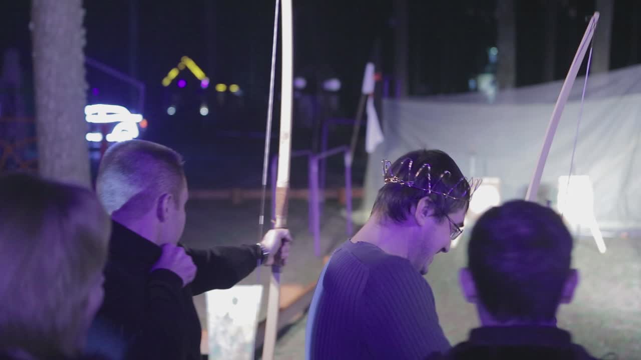 People Aims A Bow At A Target. VINNITSA, UKRAINE, MARCH 2017: people is trying aims a bow at a target