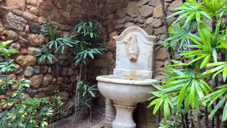 water fountain made of marble at alcazaba palace riyadh garden malaga spain