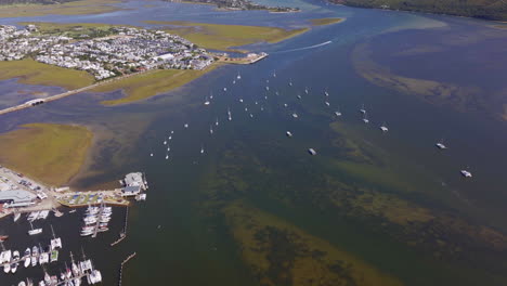 south africa garden route sailboats marina beach holiday vacation town aerial drone cinematic drive toward still bay george jeffreys bay stunning beautiful late afternoon sunny africa back pan up