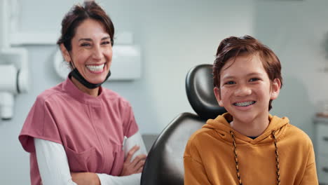 happy boy with braces smiling in the dentist's office