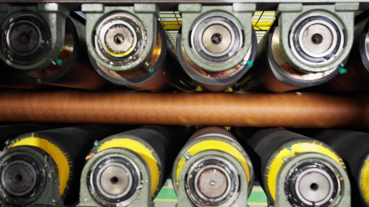 Close-up of industrial rollers in machinery
