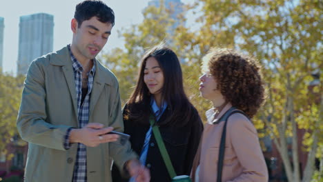 friends taking selfies in the park on after work walk