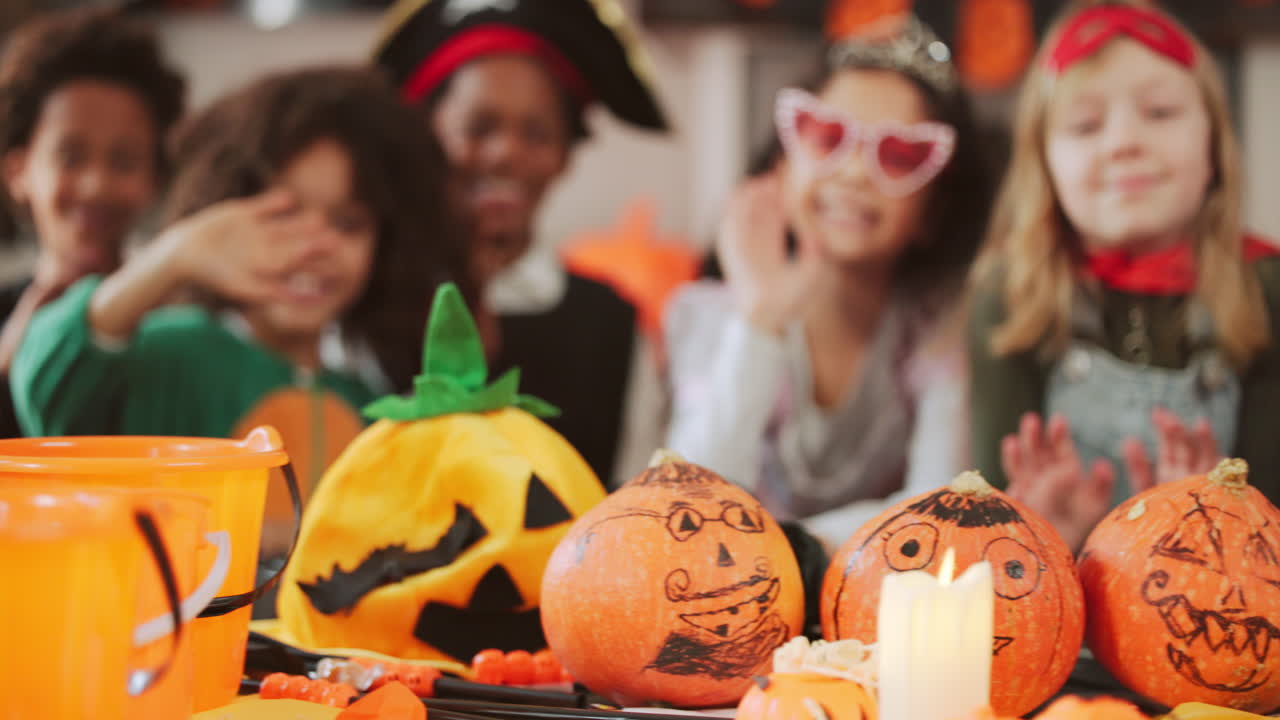 Halloween Party with Decorated Pumpkins and Children in Costumes