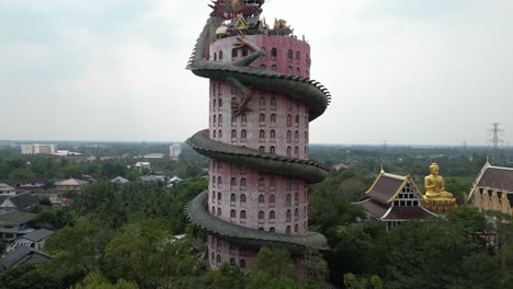 aerial-drone-view-of-buddhist-Dragon-Temple,-Wat-Sam-Phran-near-Bangkok-Thailand