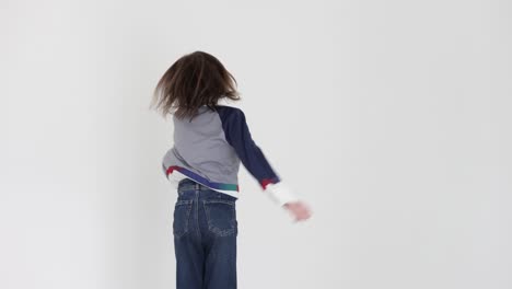 energetic child jumping on a white background