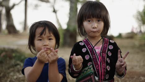 two young indigenous girls posing outdoors