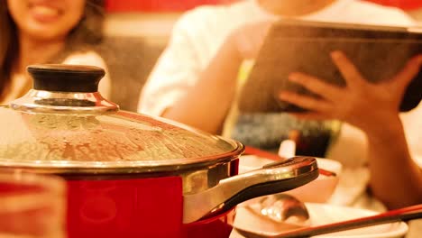 friends enjoying sukiyaki and shabu in bangkok