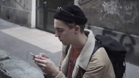 young traveler checks the message on the mobile phone