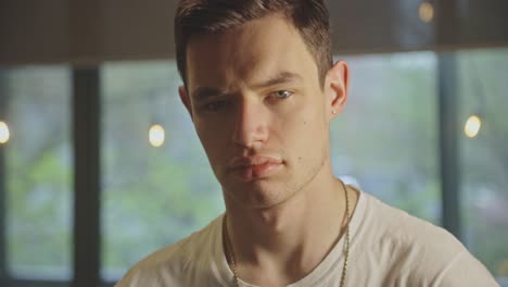 Portrait-Of-A-Serious-Caucasian-Man-Looking-Intently-At-The-Camera