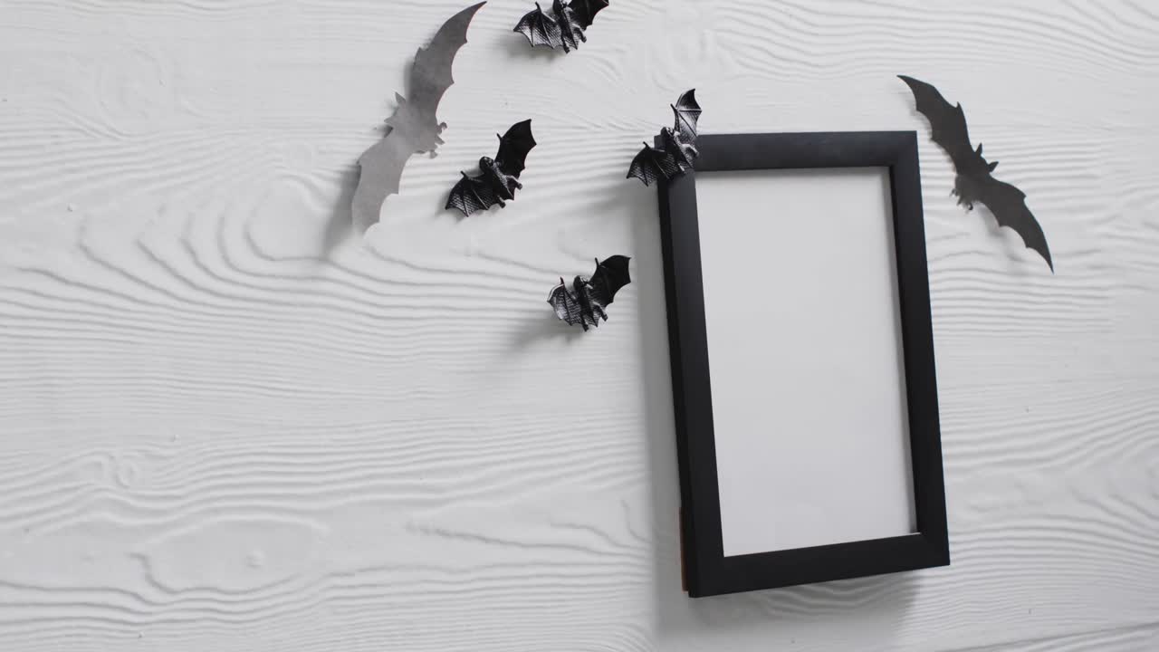 Video of black frame and bats with copy space on white background