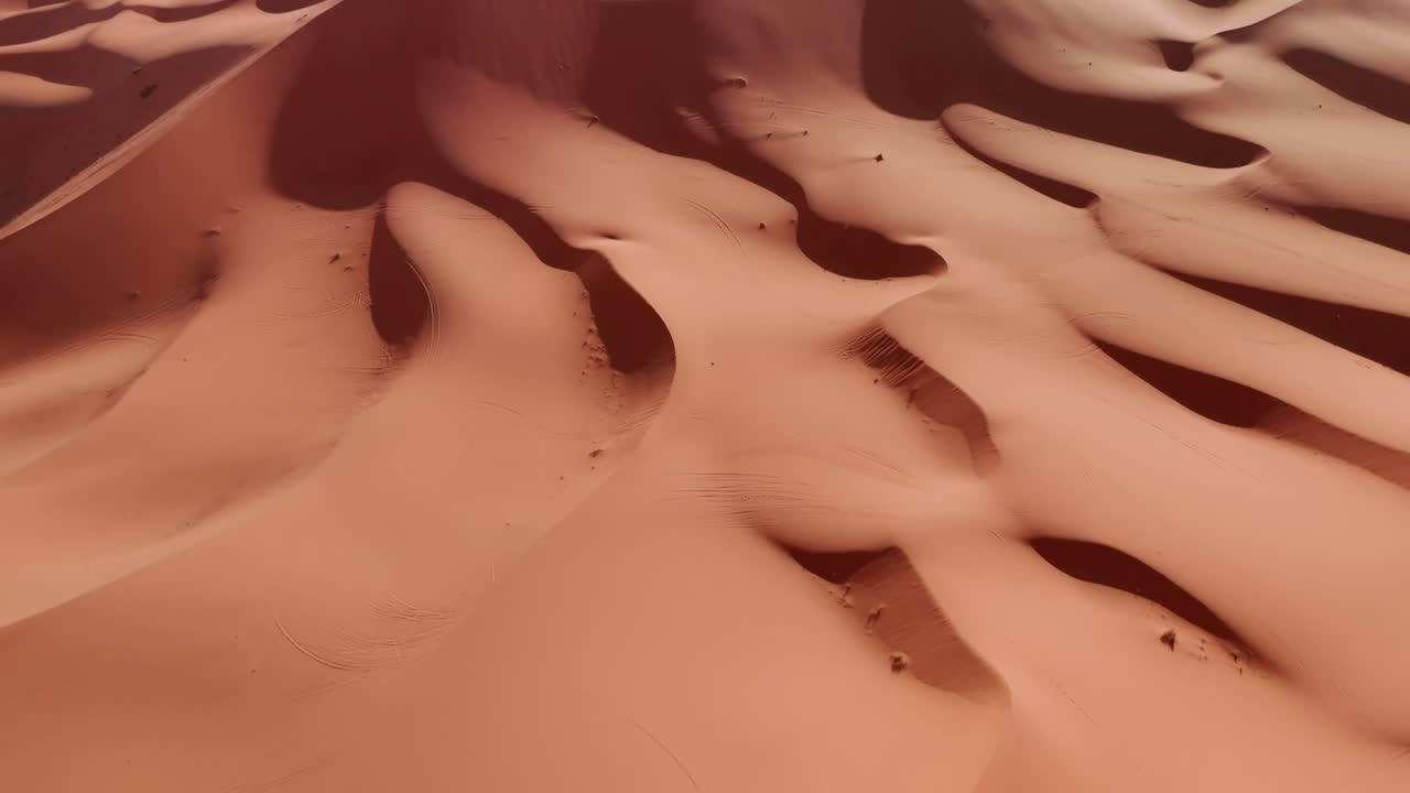 Drone shot of small and big sandy dunes in morocco desert