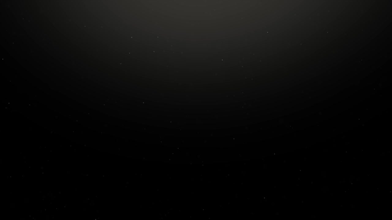 Floating organic dust particles shimmering on a black background.
