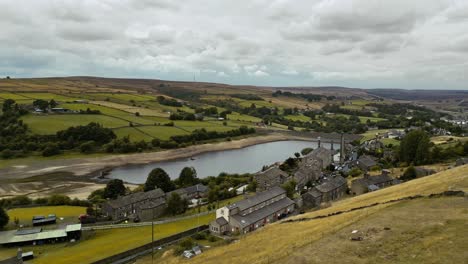 Drone-Aerial-video-of-a-industrial-rural-village-with-old-mill-and-chimney-stack-surrounded-by-fields