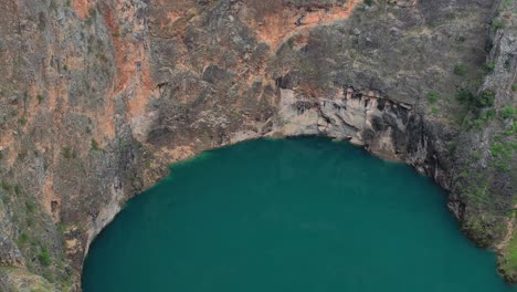 Daily-tourists-mesmerized-by-the-beauty-of-red-blue-lake-Imotski-Croatia-aerial