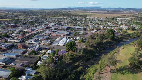 built structures and jacaranda trees on the banks of richmond river in casino, nsw, australia