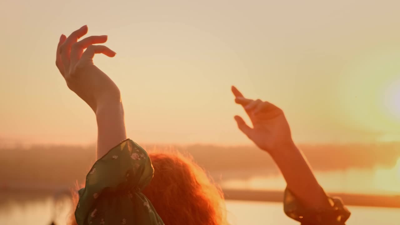 A Serene Moment at Sunset: Capturing the Beauty of Nature and Self-Expression as a Silhouette Moves Gracefully Against a Golden Horizon