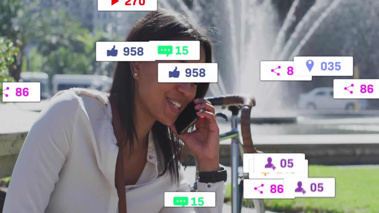 Woman leaning on fountain bench calling smartphone while social media icons multiplying then fading