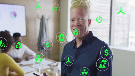 animación de iconos sobre un hombre de negocios afroamericano albino usando una tableta en la oficina.