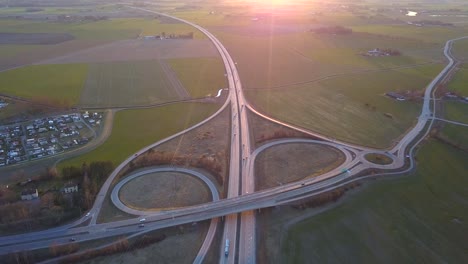 aerial view of freeway intersection with moving traffic cars