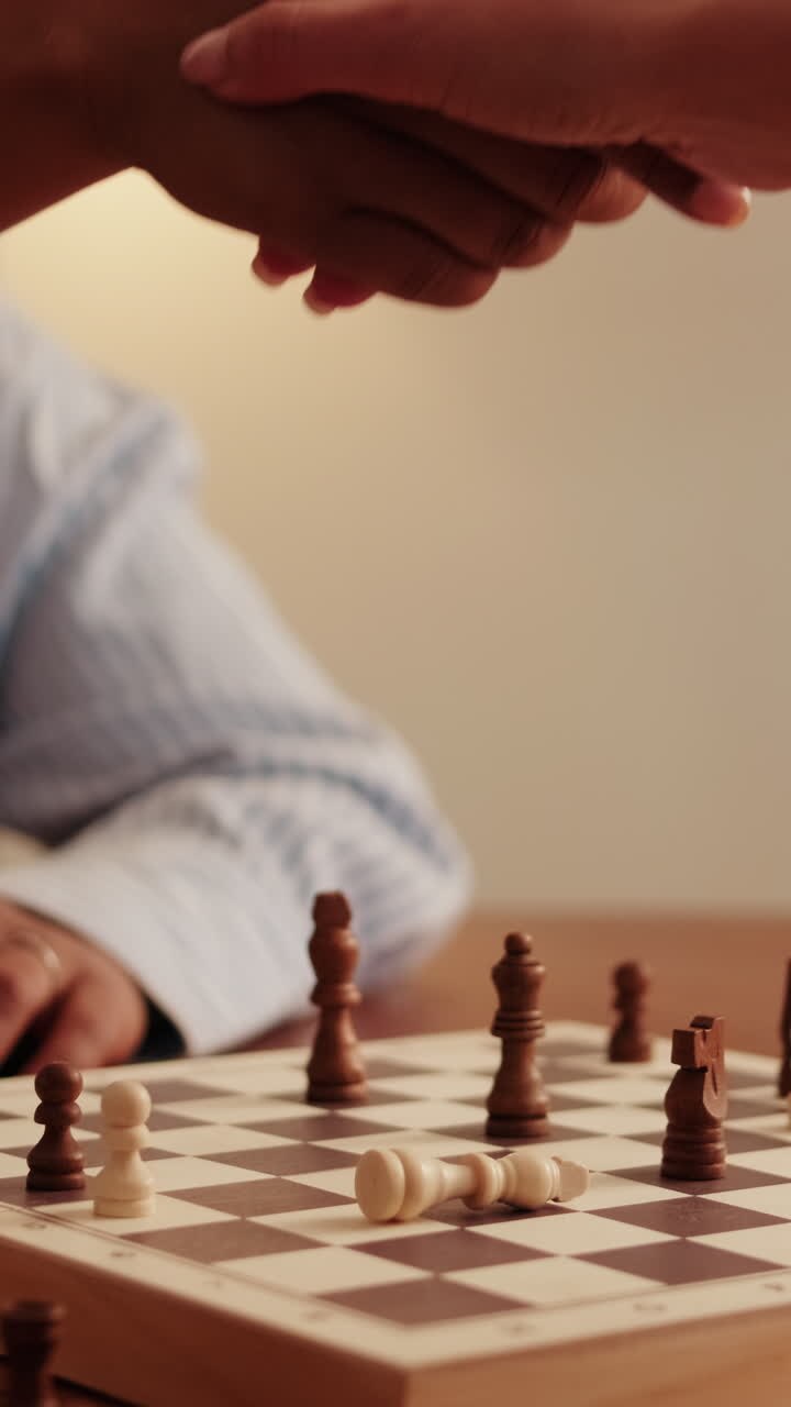 Women Playing Chess and Shaking Hands
