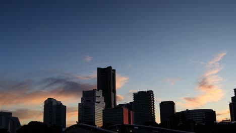 cityscape in silhouette during sunset in yokohama, japan.