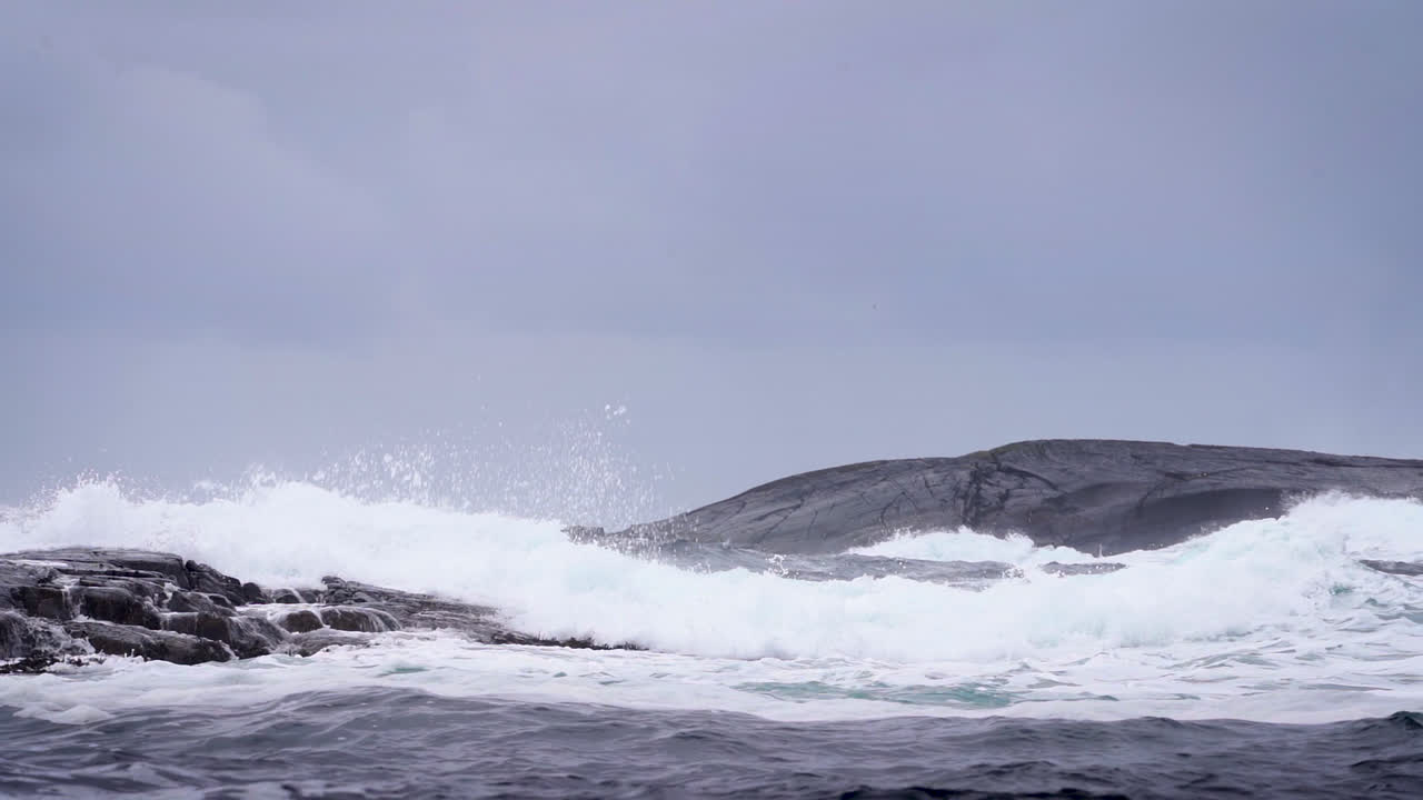 Breaking waves. Rough coastal scenery. Slow motion.