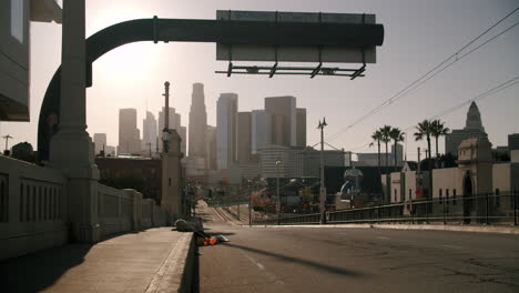 a city street and skyline at sunset