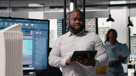 vertical video african american real estate developer reviews city planning layout on laptop