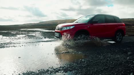 Car-Driving-Through-Puddle-In-Slow-Motion