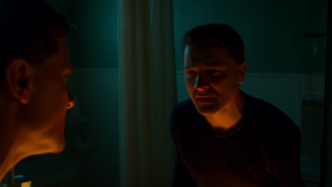 two men in a dark bathroom
