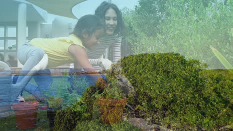 gardening together, mother and daughter planting flowers in lush green landscape