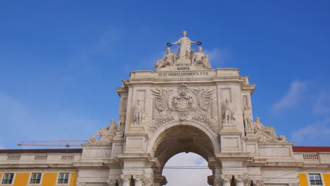 the rua augusta arch against blue sky in lisbon, portugal