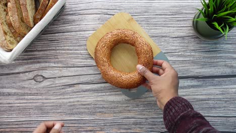 person holding a simit