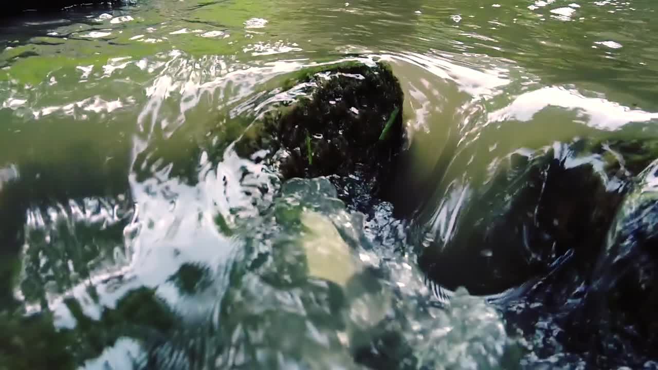 View of water pouring in a small waterfall