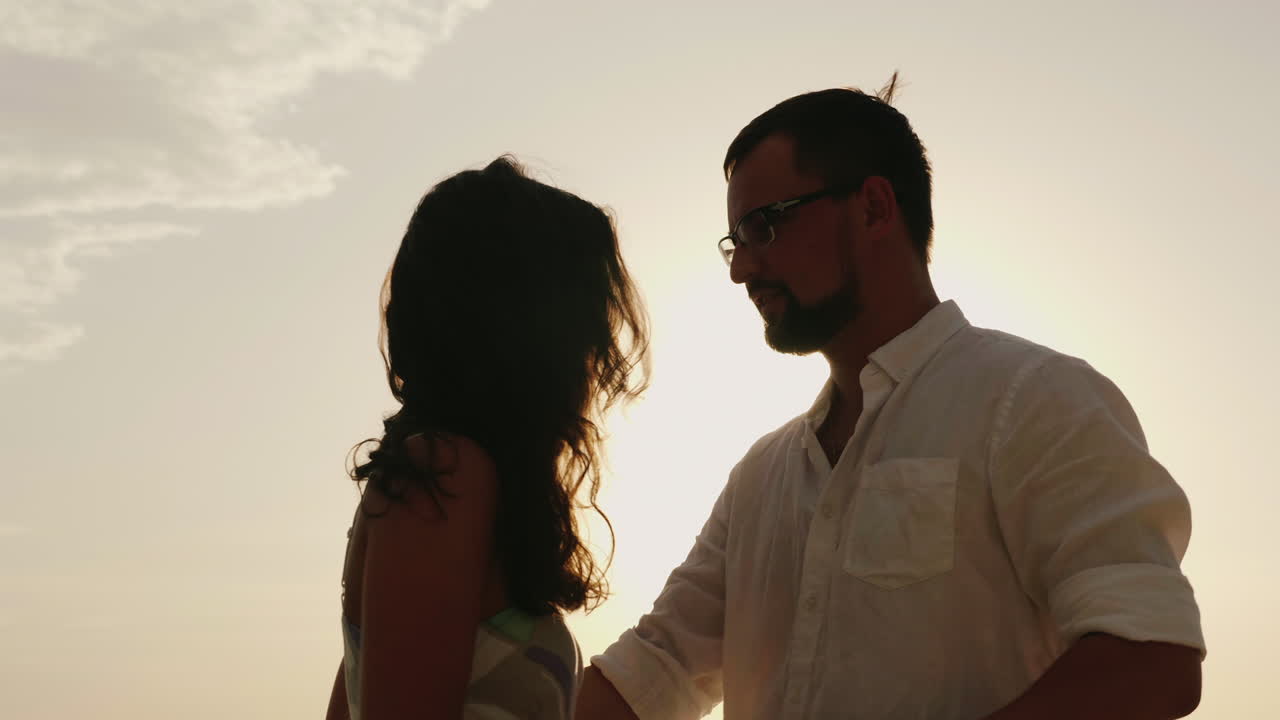 Silhouettes Of Man And Woman Kissing Against The Sky In A Hot Sunny Day Hd  Video Free Stock Video Footage Download Clips Water