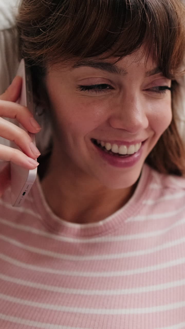 Happy Woman Talking on Phone at Home