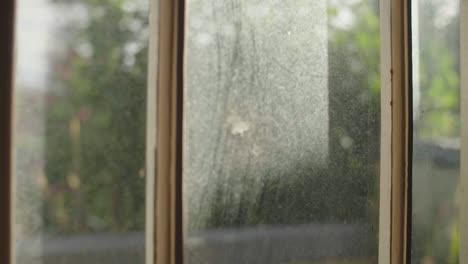 Close-up-of-sun-hitting-door-glass