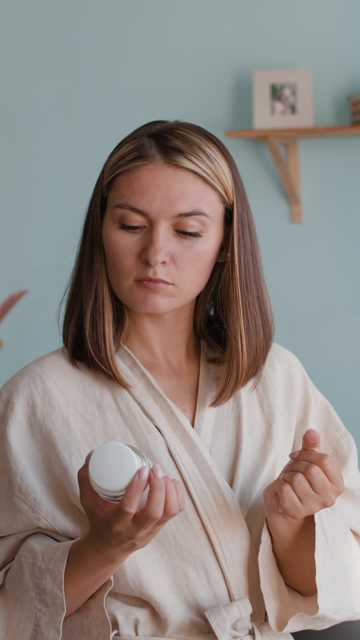 Woman holding a jar of cream