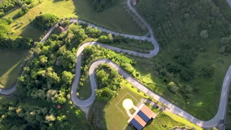 winding road leading up to renaissance tuscany il ciocco resort in tuscany italy