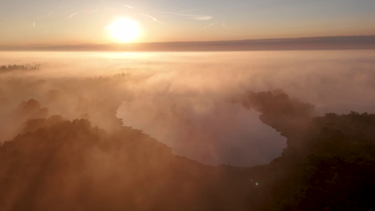 Aerial View of Misty Lake and Forest at Sunrise or Sunset