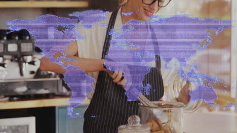 female barista placing pastries into glass jar in cafe kitchen, with purple world map overlay