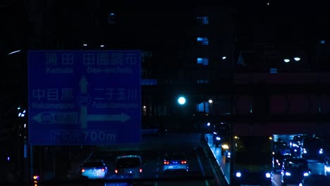 a night timelapse of the traffic jam at the city street in tokyo long shot