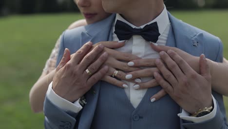 newlyweds. caucasian groom with bride in the park. wedding couple. happy family