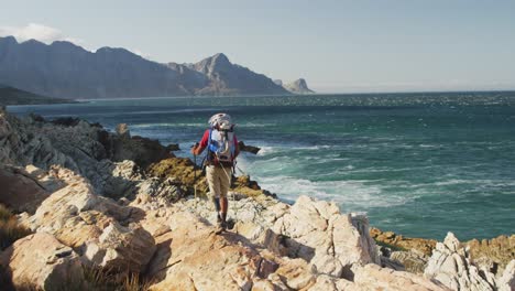 Mixed-race-man-with-prosthetic-leg-hiking-in-nature