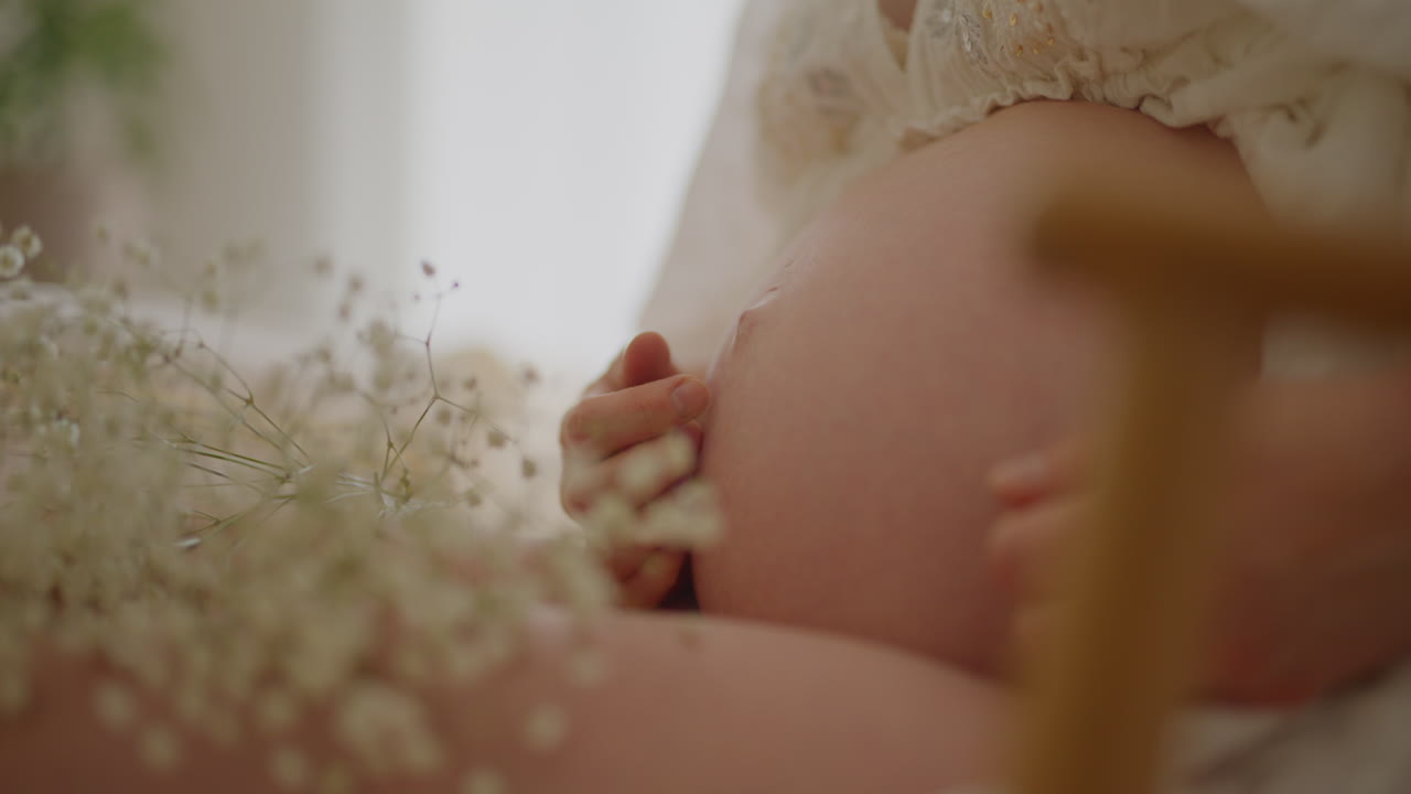 Pregnant Woman Gently Caressing Her Belly Close-up