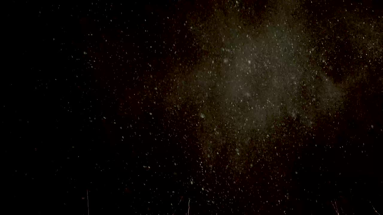 Snow drifting and swirling in the frigged cold night air as a blustery winter storm blows in, from this smooth steady clip